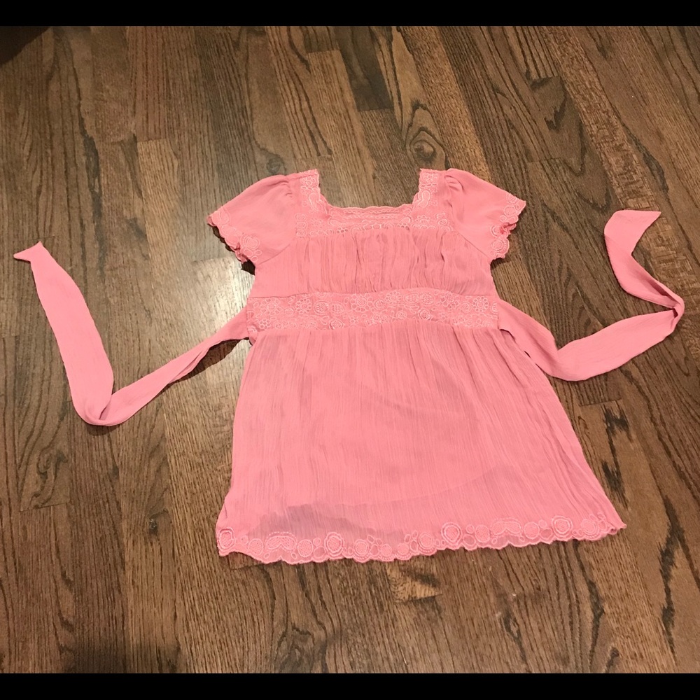 A lightly used beautiful light pink blouse